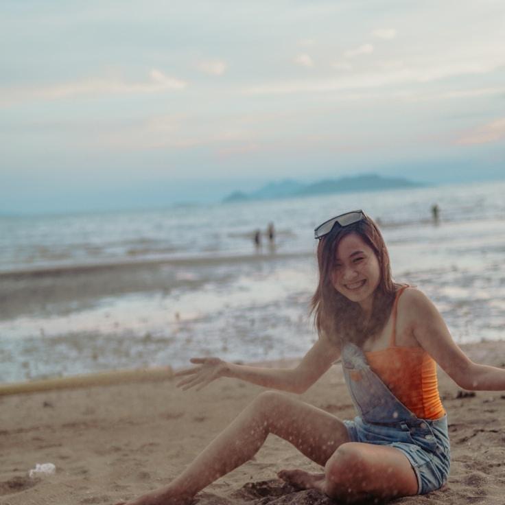 Avery Lane, Lead Design Curator at Pacific Valley Connection, reviewing corporate floral arrangements