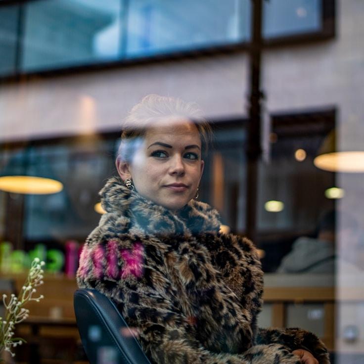 Alex Chen, Client Relations Director, discussing corporate gifting strategy with business clients